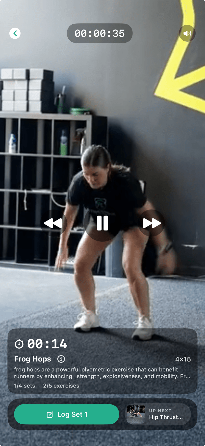 FitnessLink live workout session with exercise video, timer, and set logging